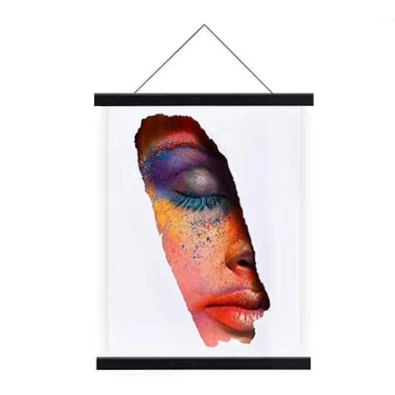 Framed artwork of a colorful face with closed eyes on a white background