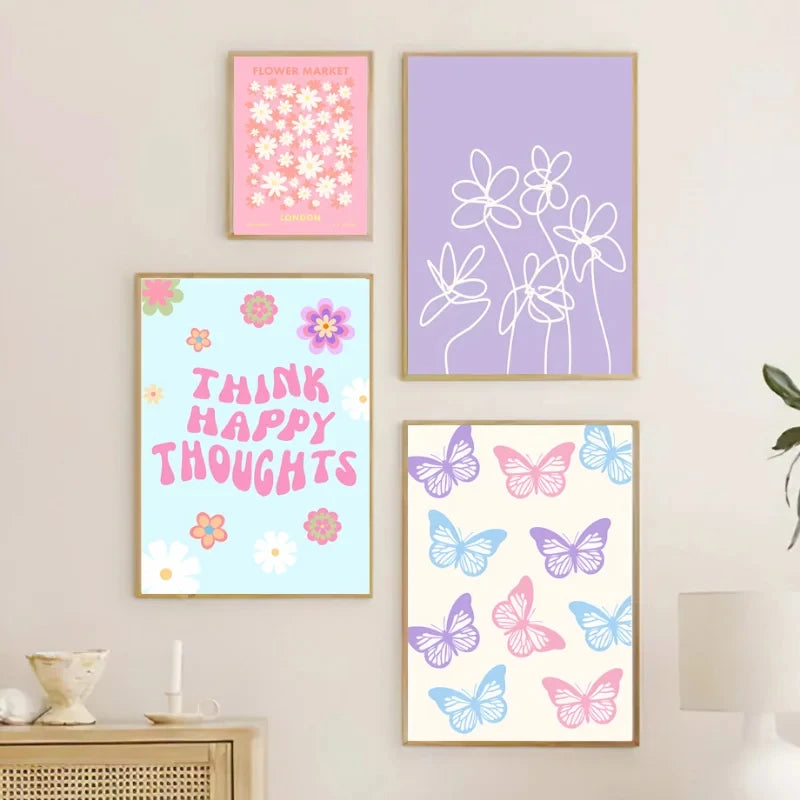 Set of four colorful framed prints on a wall, featuring floral and butterfly designs.