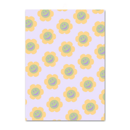 Notebook with a pattern of yellow flowers with smiley face centers on a purple background