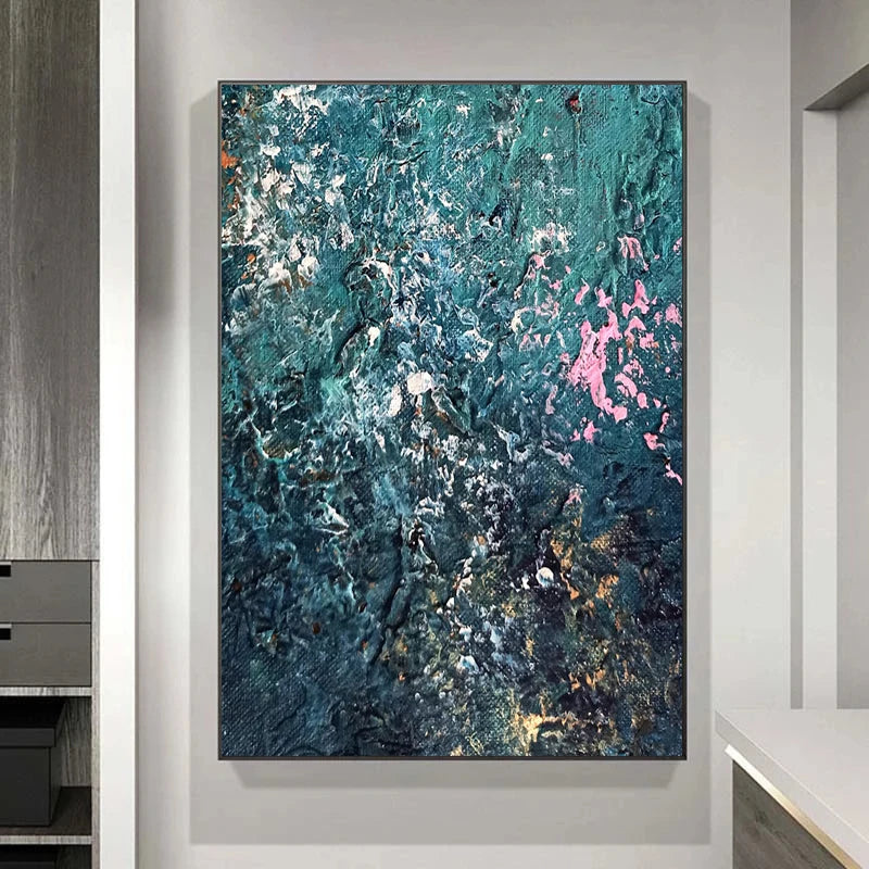 Abstract painting with blue, pink, and white colors on a gray wall.