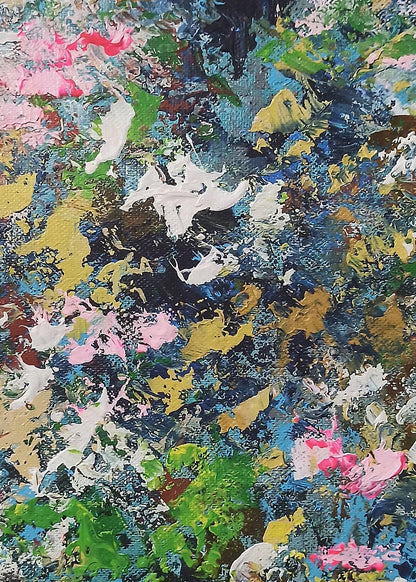 Abstract art with splashes of pink, green, blue, and yellow on a dark background