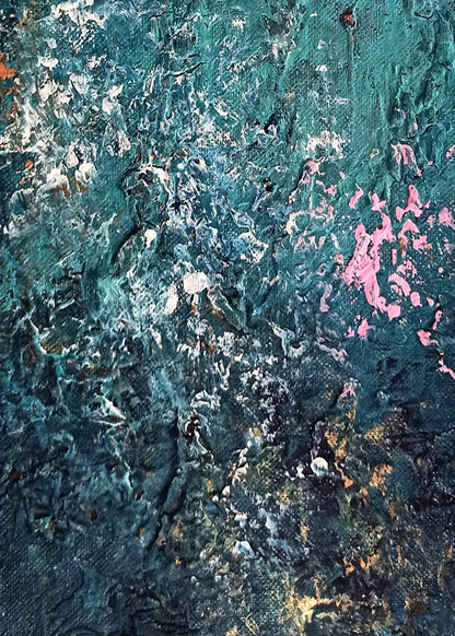 Close-up of textured surface with blue, pink, and orange colors