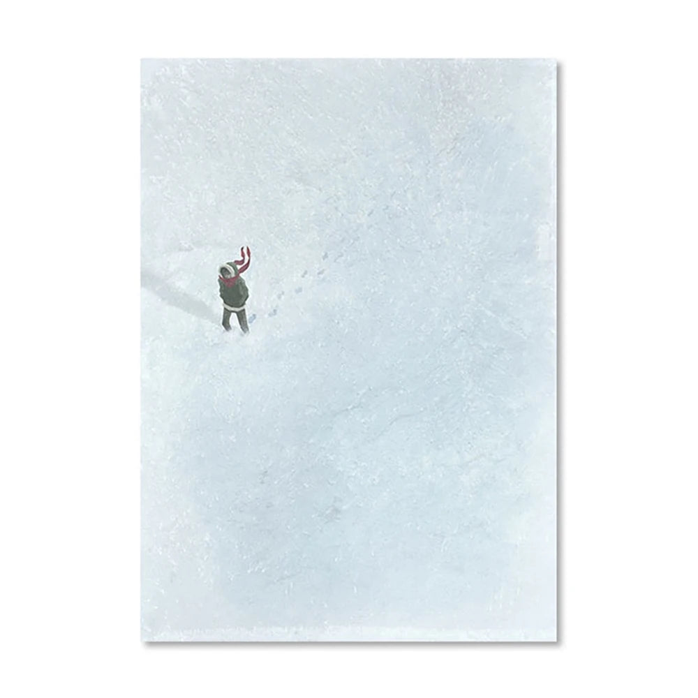 Person with a backpack standing on a snowy landscape
