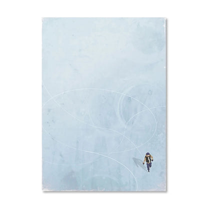 Person walking on a snowy landscape with a blue sky