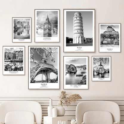Set of black and white cityscape prints on a wall above a sofa.