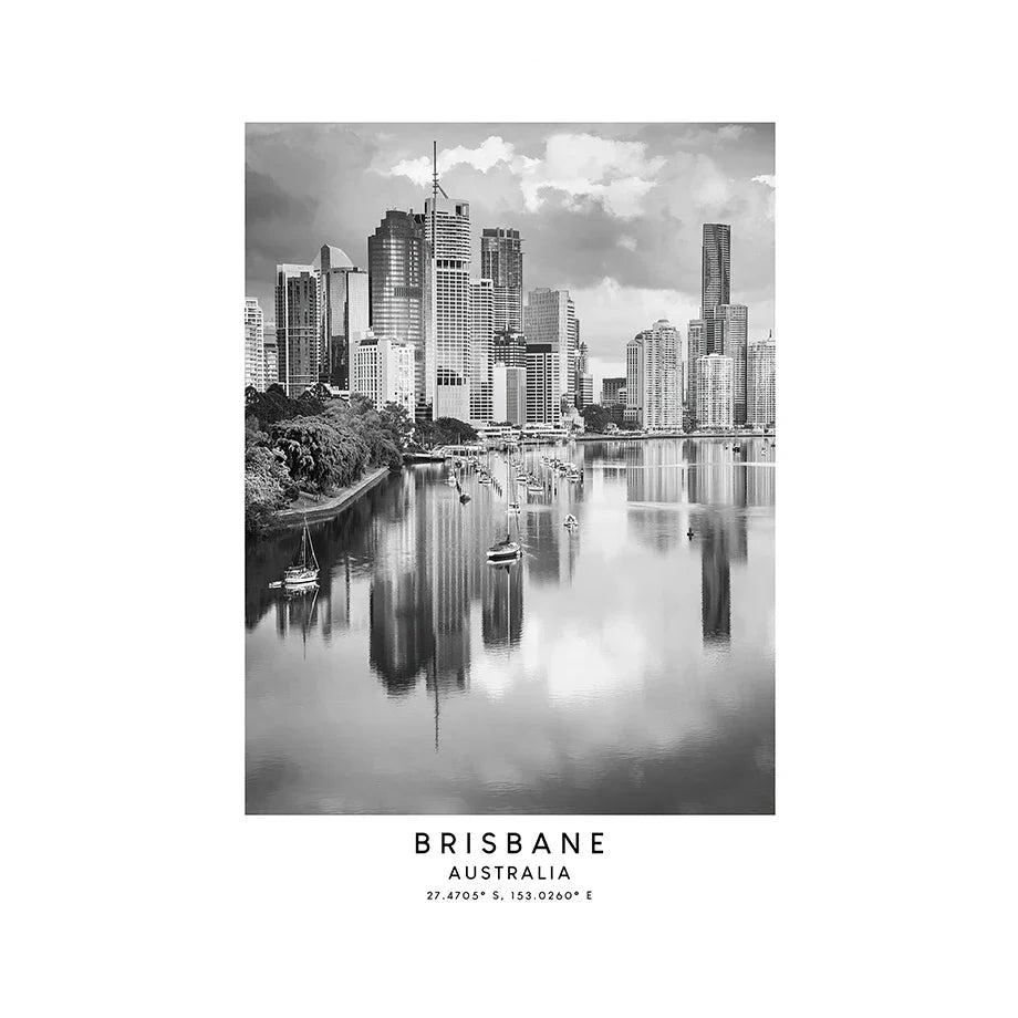 Black and white photo of a historic building in Brisbane, Australia with a river and skyscrapers.