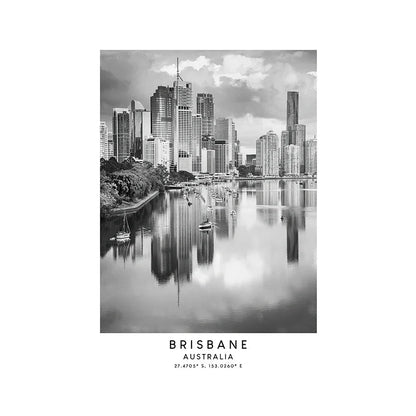 Black and white photo of a historic building in Brisbane, Australia with a river and skyscrapers.