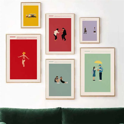 Set of framed artworks on a wall above a green sofa