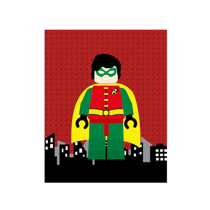 Toy figure of a superhero in a red and green costume with a yellow cape on a red brick background.