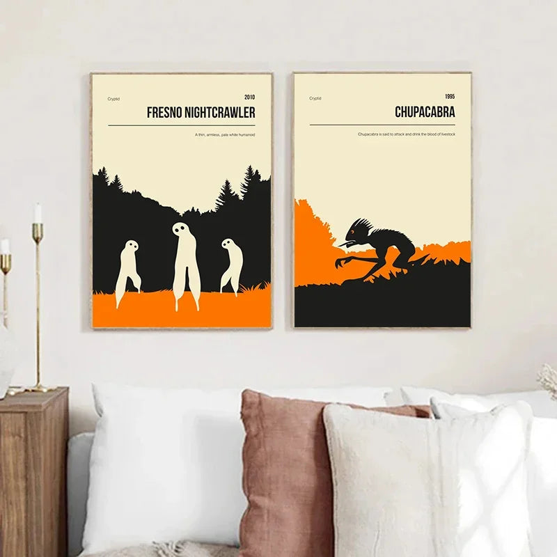 Two framed posters on a wall above a bed with pillows.