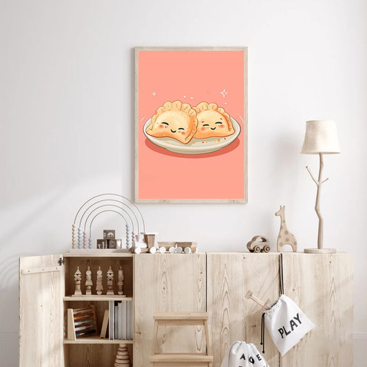 Framed artwork of two smiling dumplings on a plate against a pink background, hanging above a wooden cabinet. Canvas & Curio