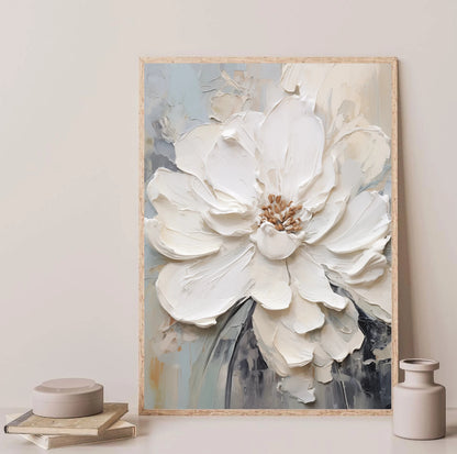 Framed artwork of a large white flower on a neutral background