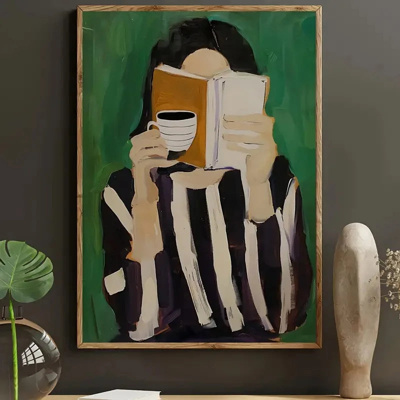 Framed artwork of a person holding a book and a cup against a green background