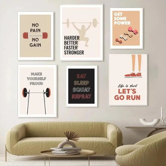 Wall with motivational fitness posters above a living room sofa. Canvas & Curio