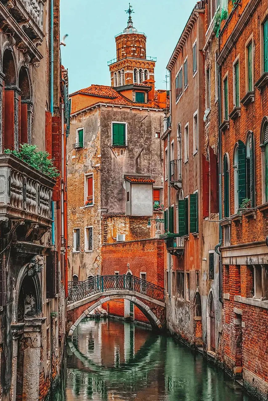  narrow canal with old buildings in Venice