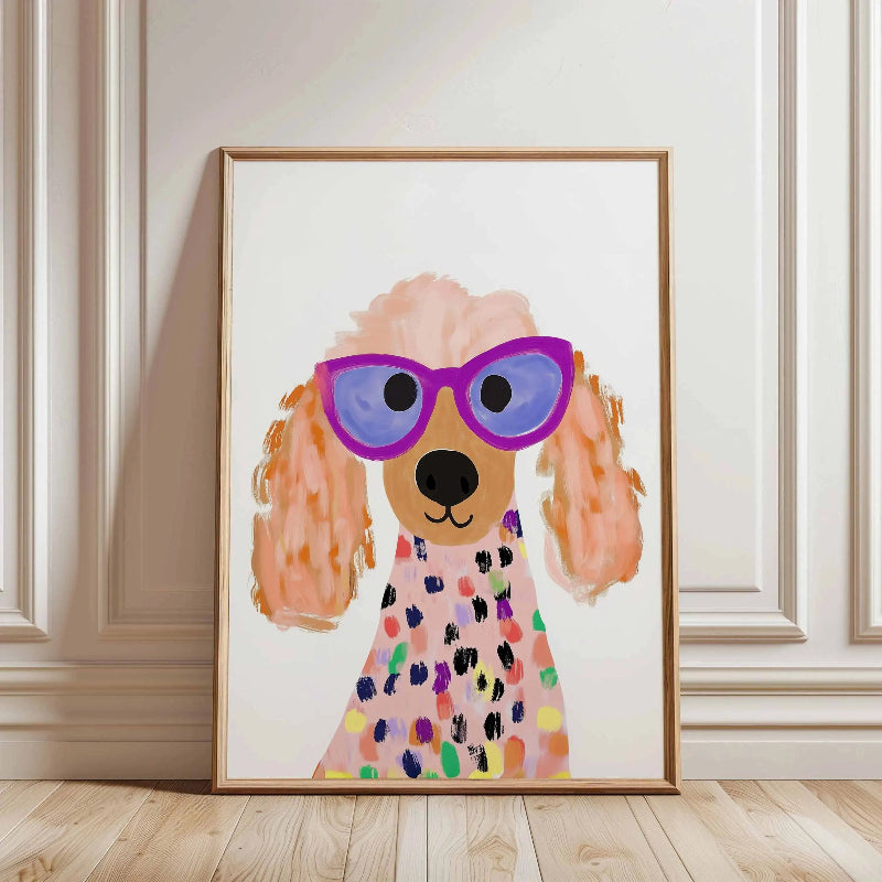 Framed artwork of a dog wearing sunglasses and a colorful dress on a wall.