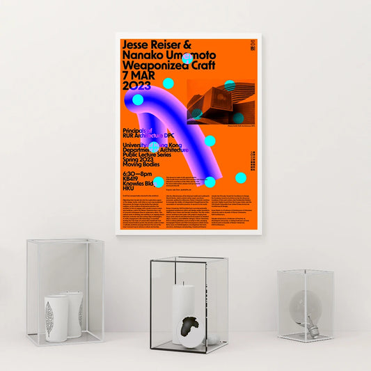 Poster with event details on an orange background, displayed on a white wall with decorative items below. Canvas & Curio