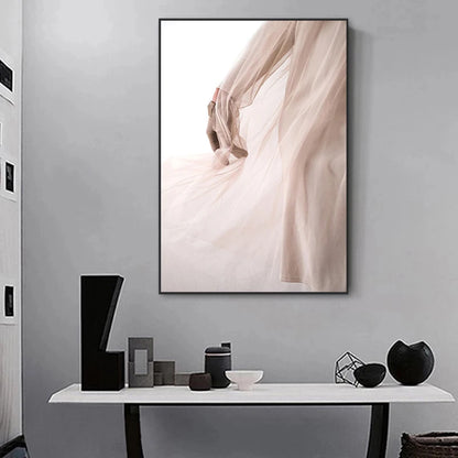 Framed abstract art on a gray wall above a console table with decorative items.