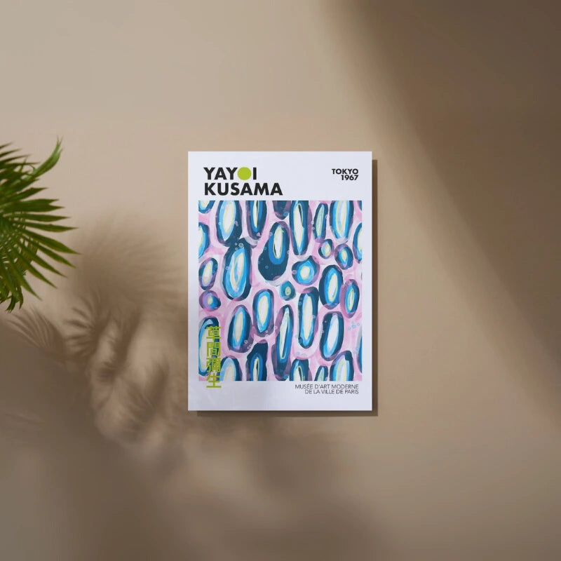 Yayoi Kusama poster with abstract design on a beige wall