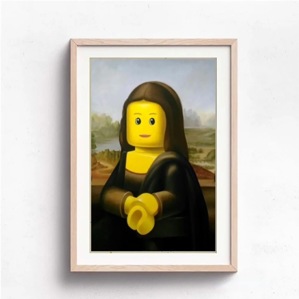 Framed artwork of a Mona Lisa with a Lego head on a white wall