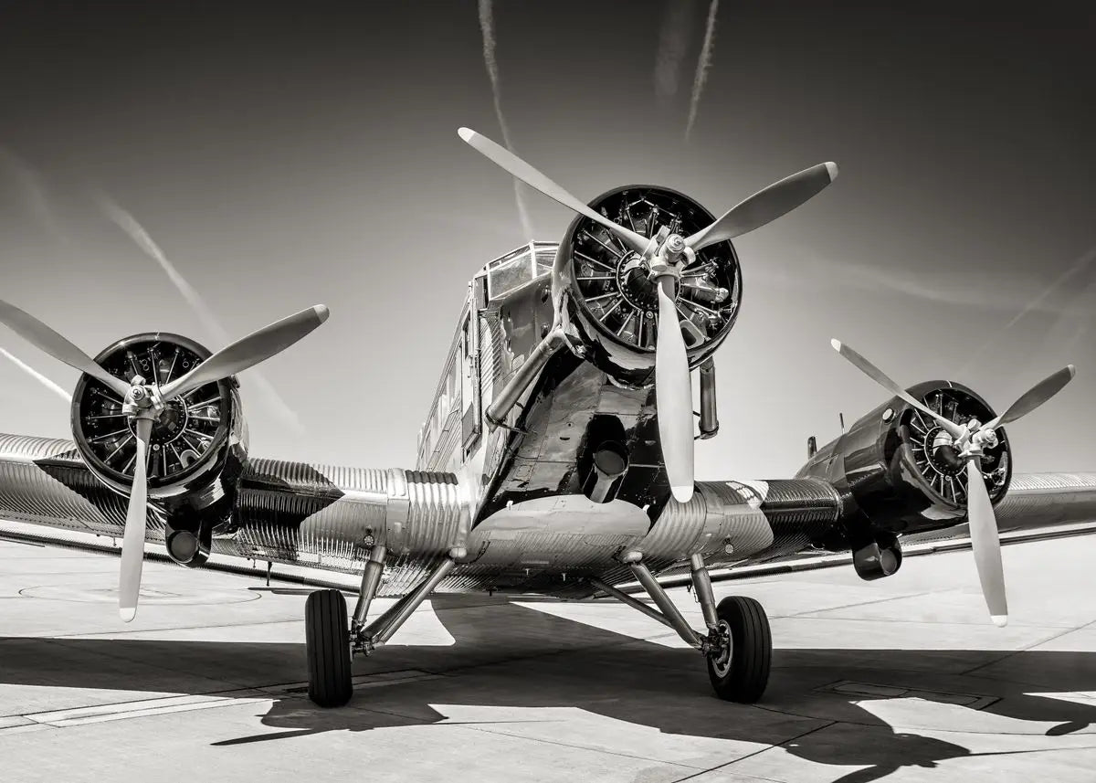 Vintage airplane with three propellers on a runway