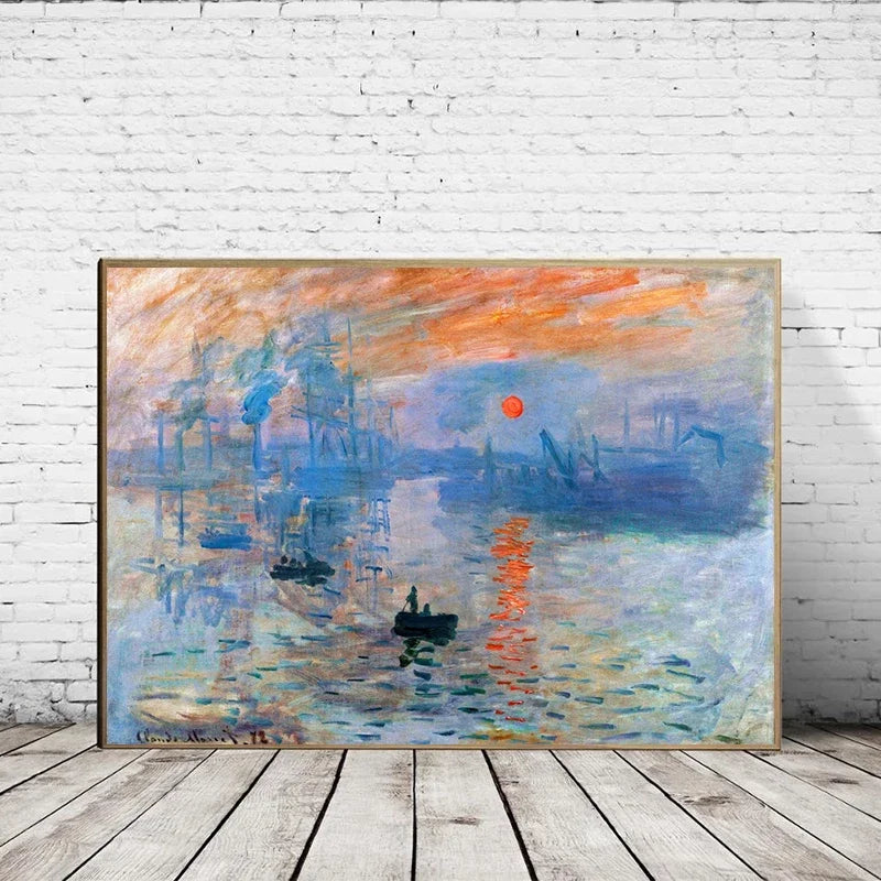 Framed painting of a sunset over water on a white brick wall.
