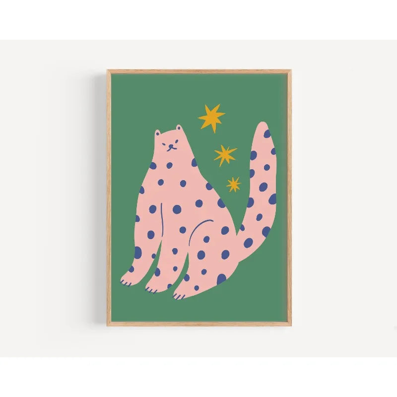 Framed artwork of a pink polka-dotted cat on a green background with yellow stars.