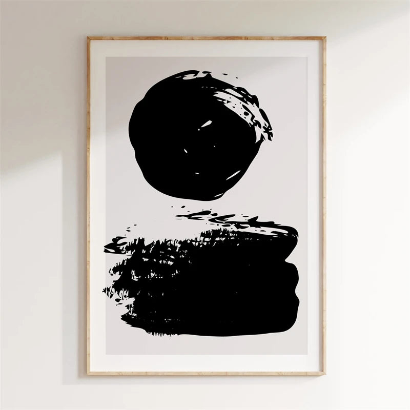 Framed abstract art print with black brush strokes on a white background