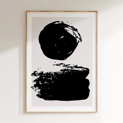 Framed abstract art print with black brush strokes on a white background
