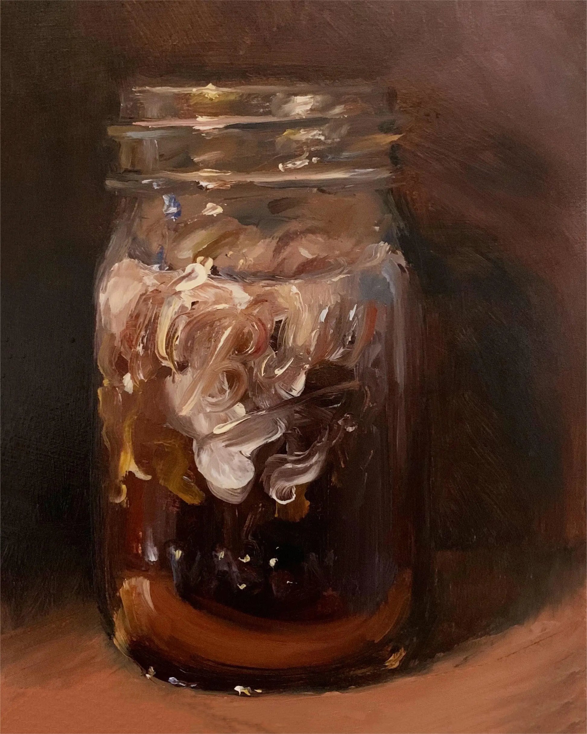 Glass jar with seashells on a brown background