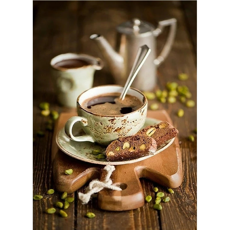 Cup of coffee with a spoon, cookies, and teapot on a wooden surface