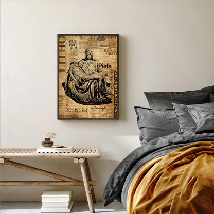 Framed artwork of a classical sculpture above a bed with gray bedding and a wooden bench.