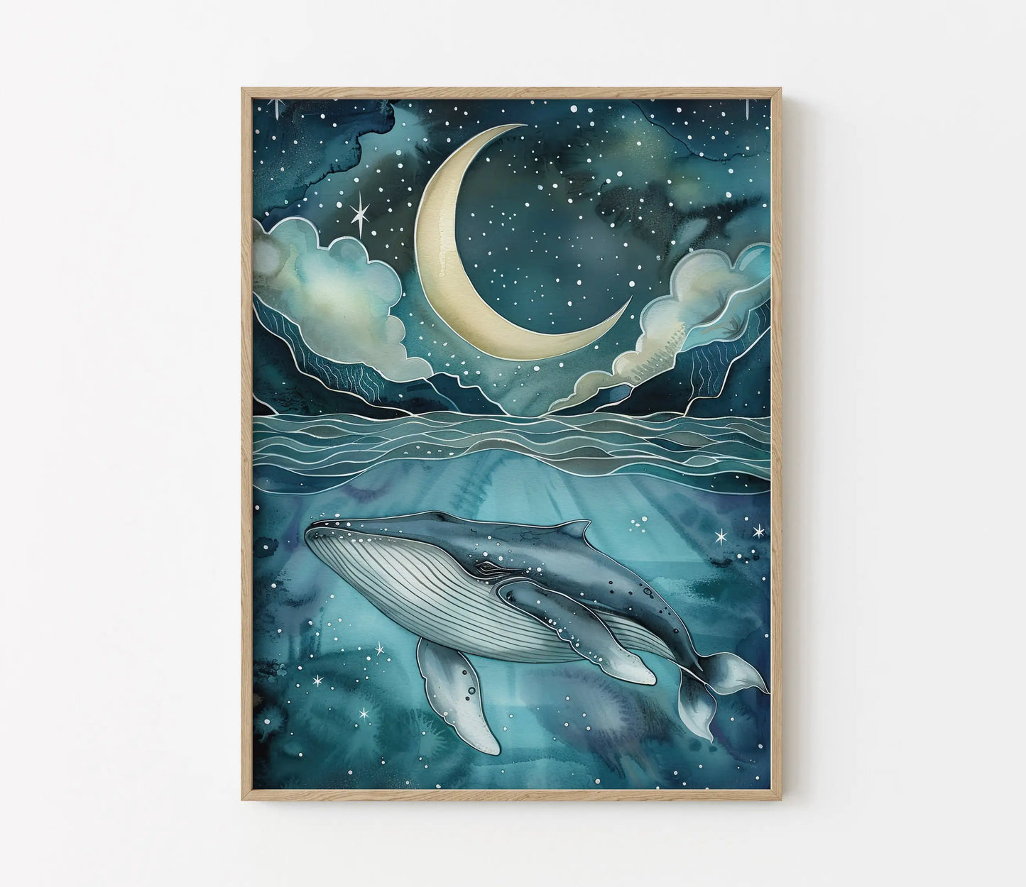 Framed artwork of two whales swimming under a crescent moon and stars.