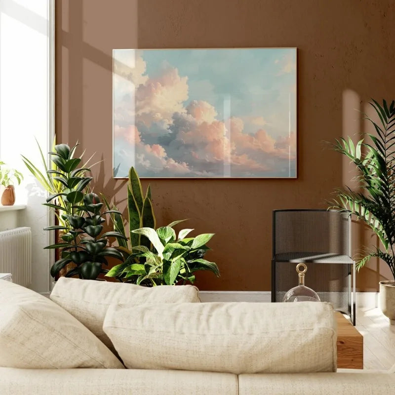 Living room with a beige sofa, plants, and a painting of clouds on a brown wall.