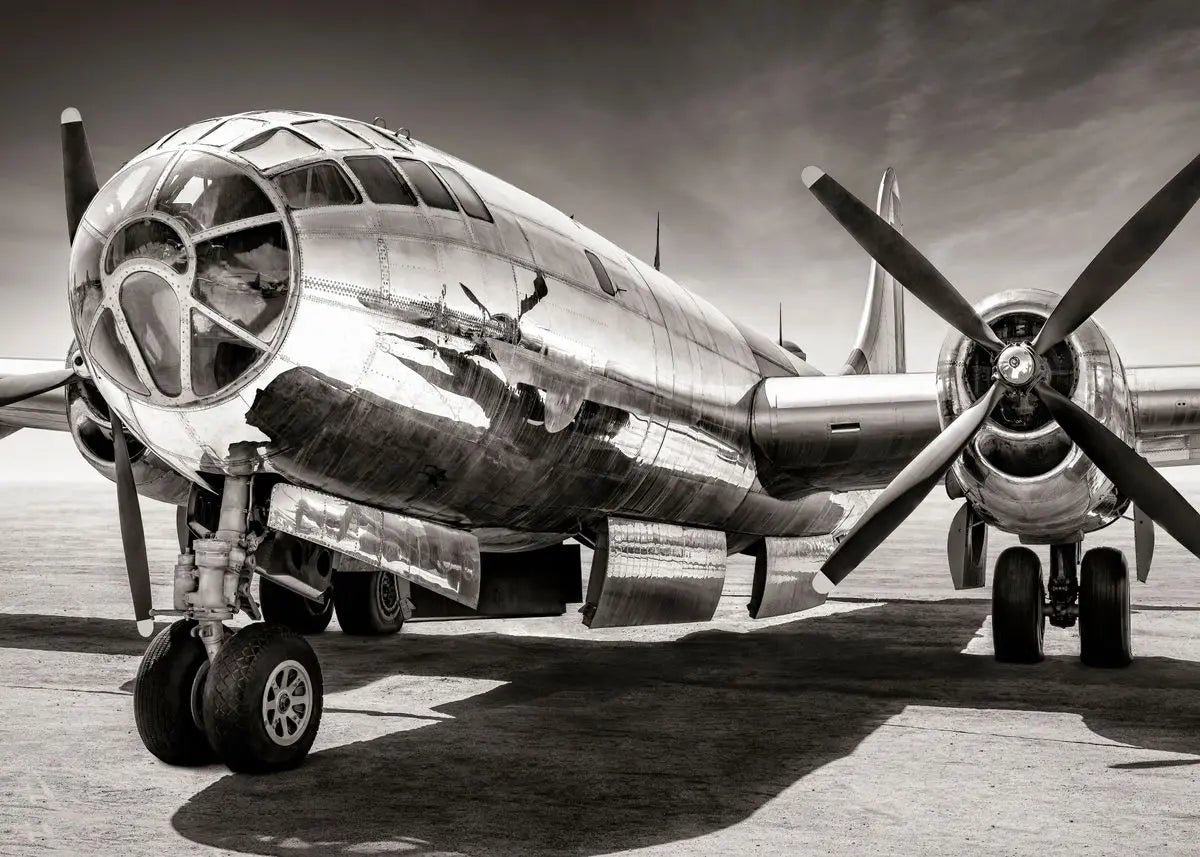 Vintage airplane on a runway with a dramatic sky.