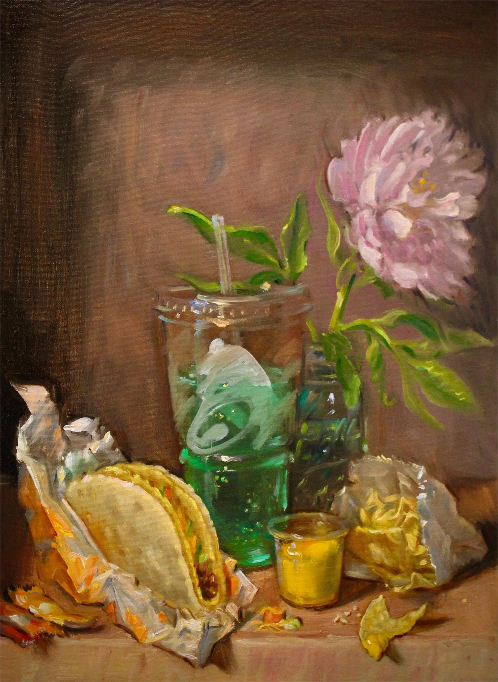 Still life with tacos, a drink, and a flower on a wooden surface.