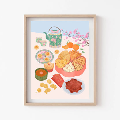Framed artwork of a colorful illustration of food and tea set on a white wall.