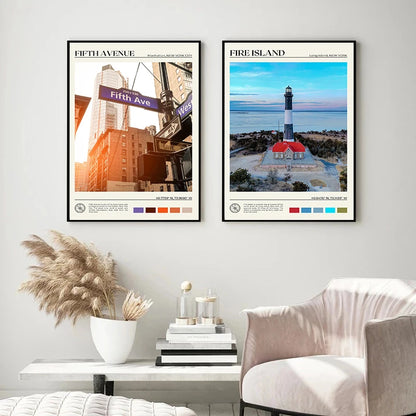 Two framed posters on a wall above a white armchair and coffee table.