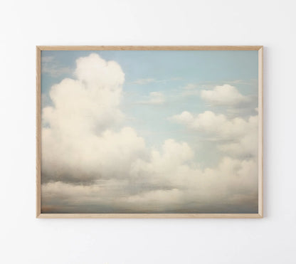Framed photograph of a cloudy sky on a white wall
