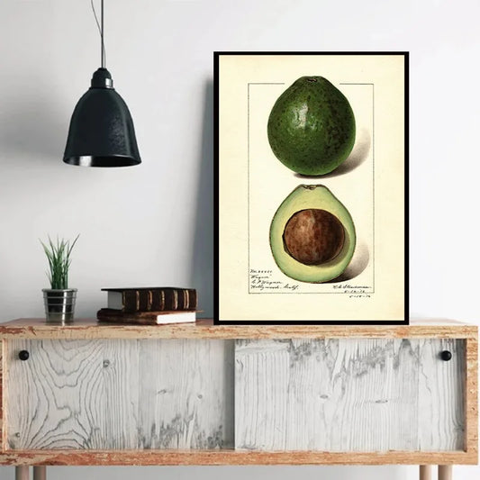 Avocado poster on a wall above a wooden console table with decor items. Canvas & Curio