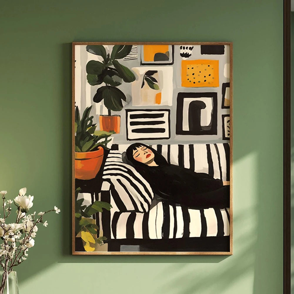 Framed artwork of a woman lying on a striped bed with plants and abstract elements on a green wall.