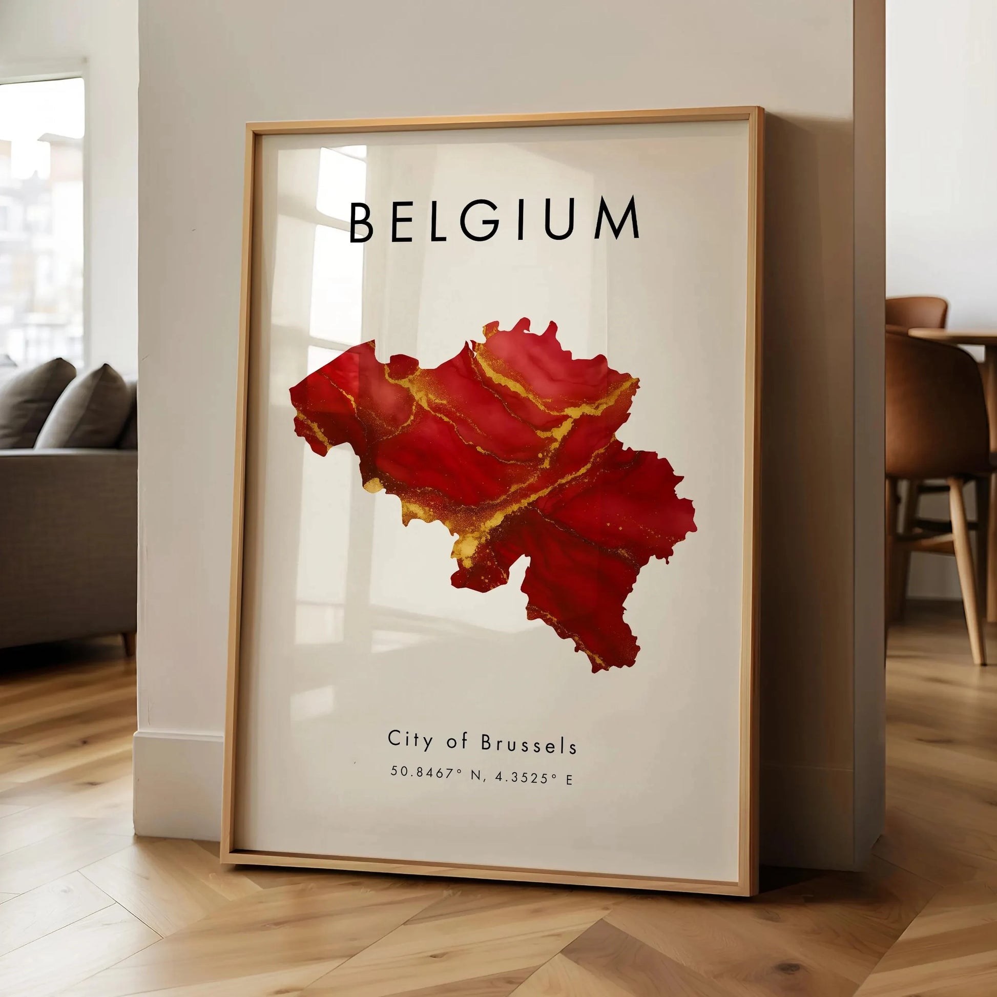 Framed map of Belgium with 'Belgium' and 'City of Brussels' text in a room.