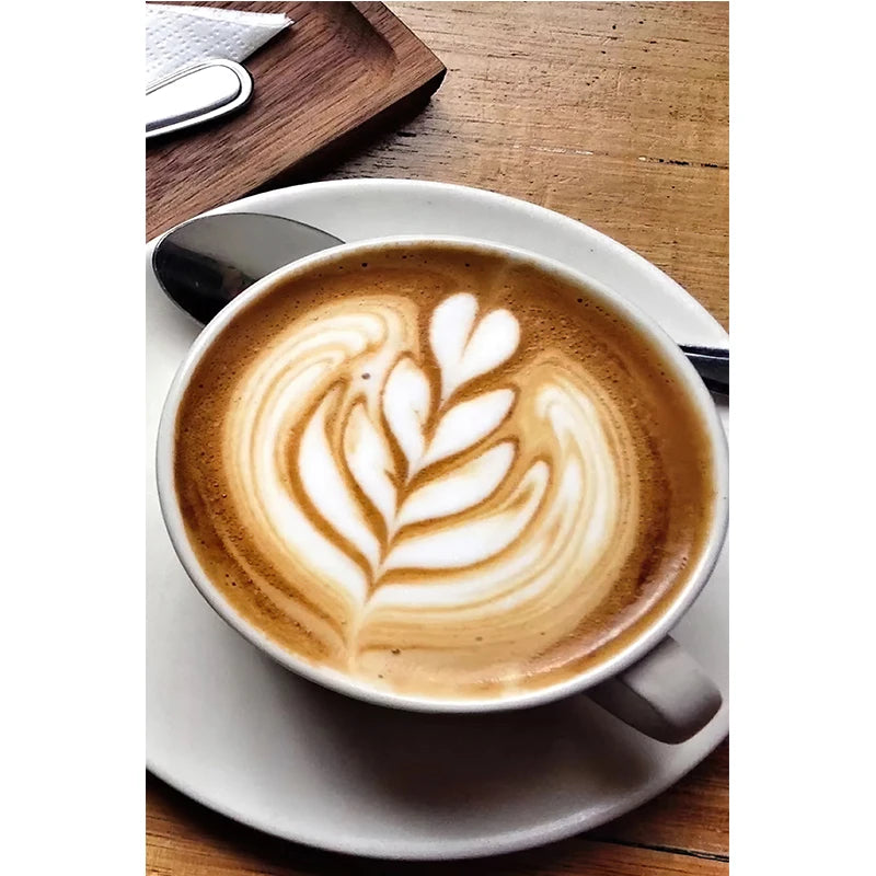 Cappuccino with latte art on a wooden table