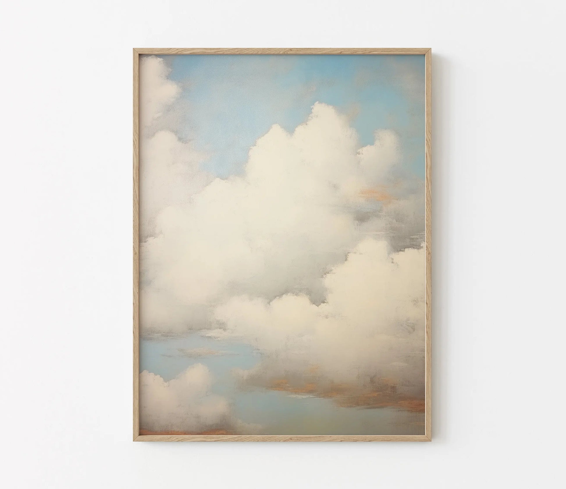 Framed artwork of clouds on a white wall