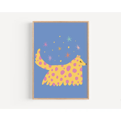 Framed artwork of a yellow and pink spotted creature on a blue background