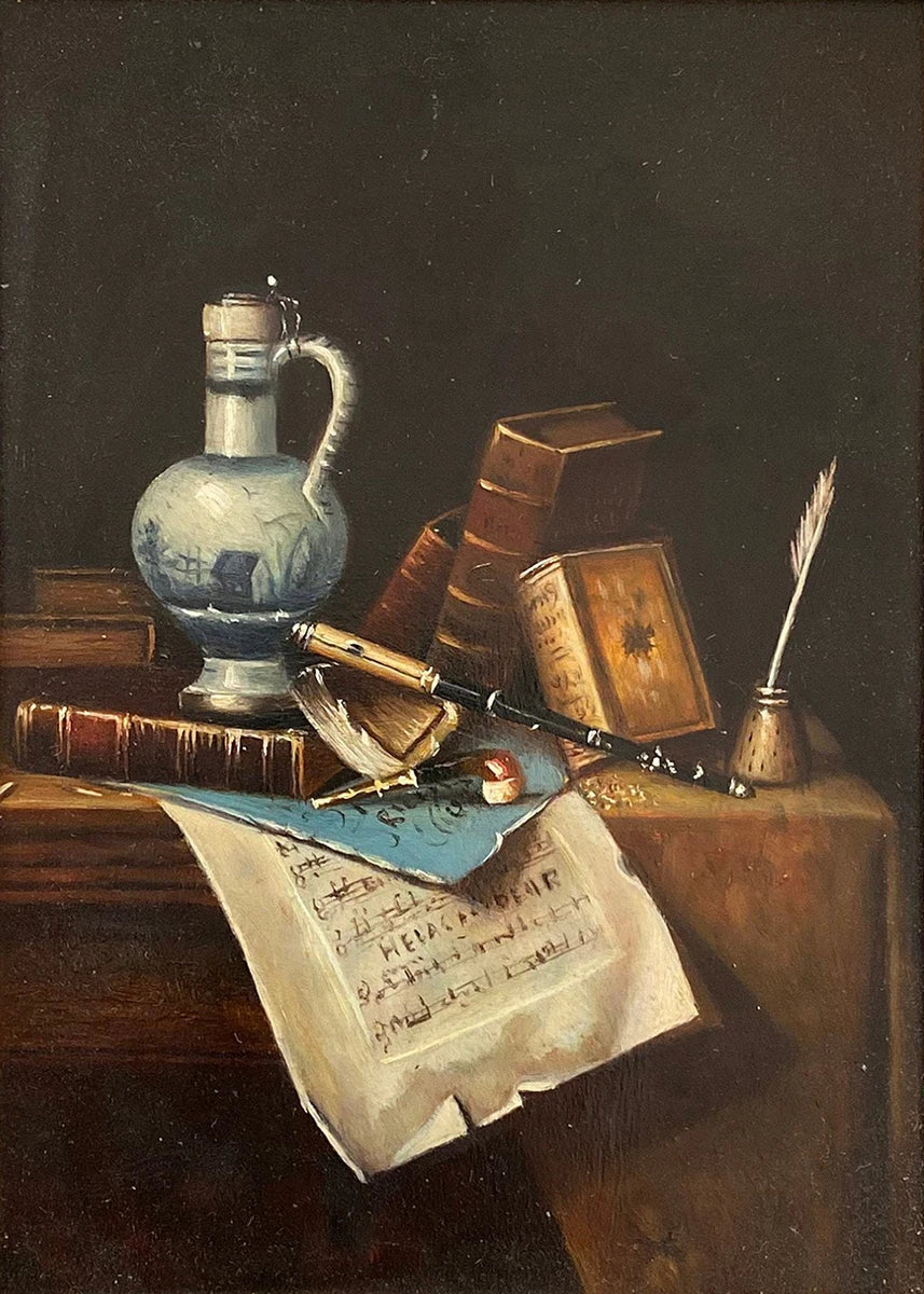 Still life with a blue glass jar, books, quill, and inkwell on a wooden surface.