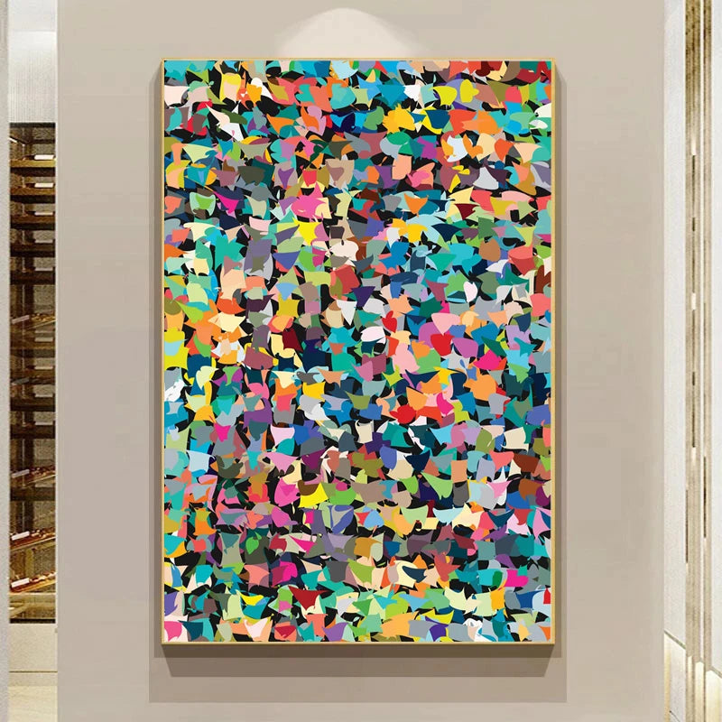 Colorful abstract art piece on a wall in a room with shelves.
