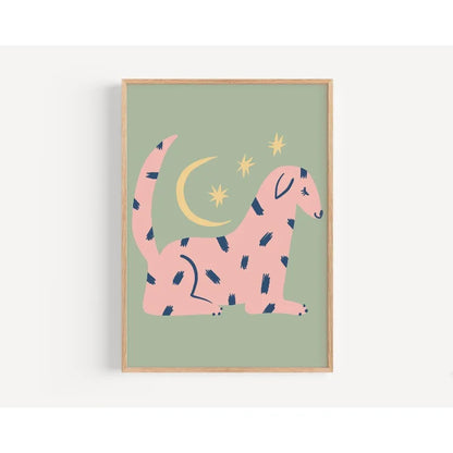 Framed artwork of a pink dinosaur with blue spots on a green background