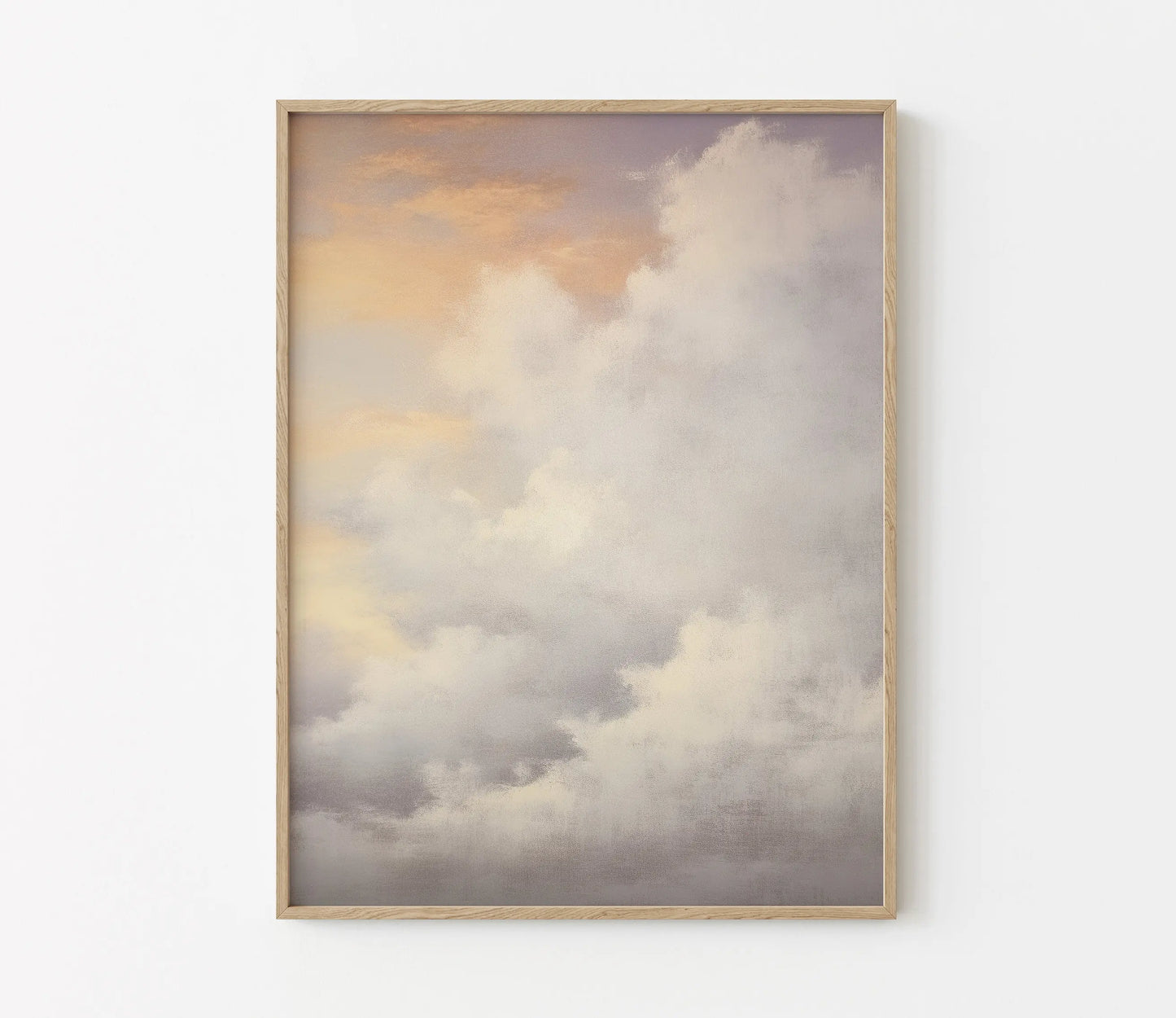 Framed artwork of a cloud scene on a white wall