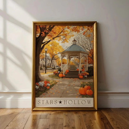Framed artwork of a gazebo with pumpkins and autumn leaves, titled 'Stars Hollow', on a wall.